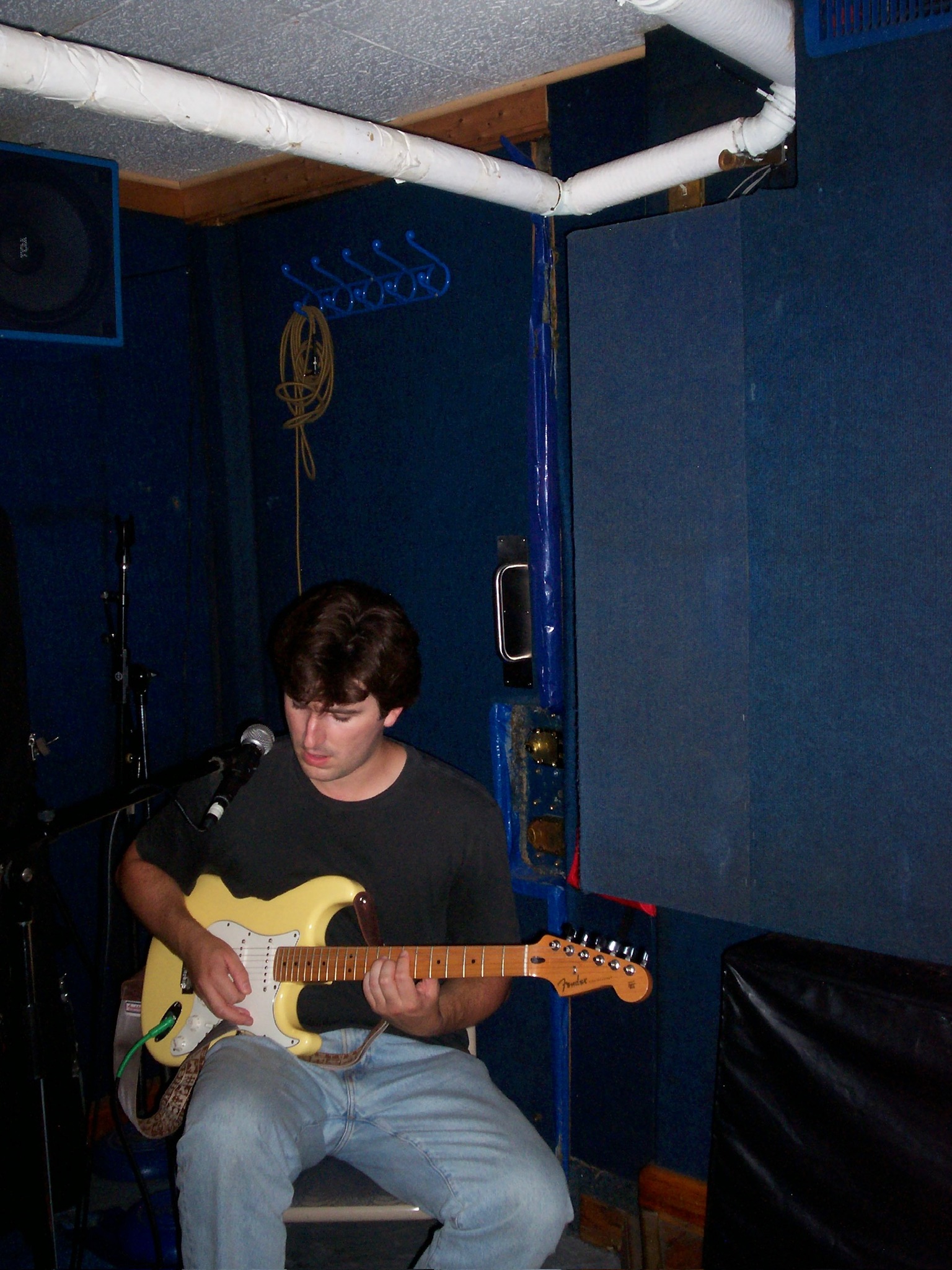 guitarist in a rehearsal room