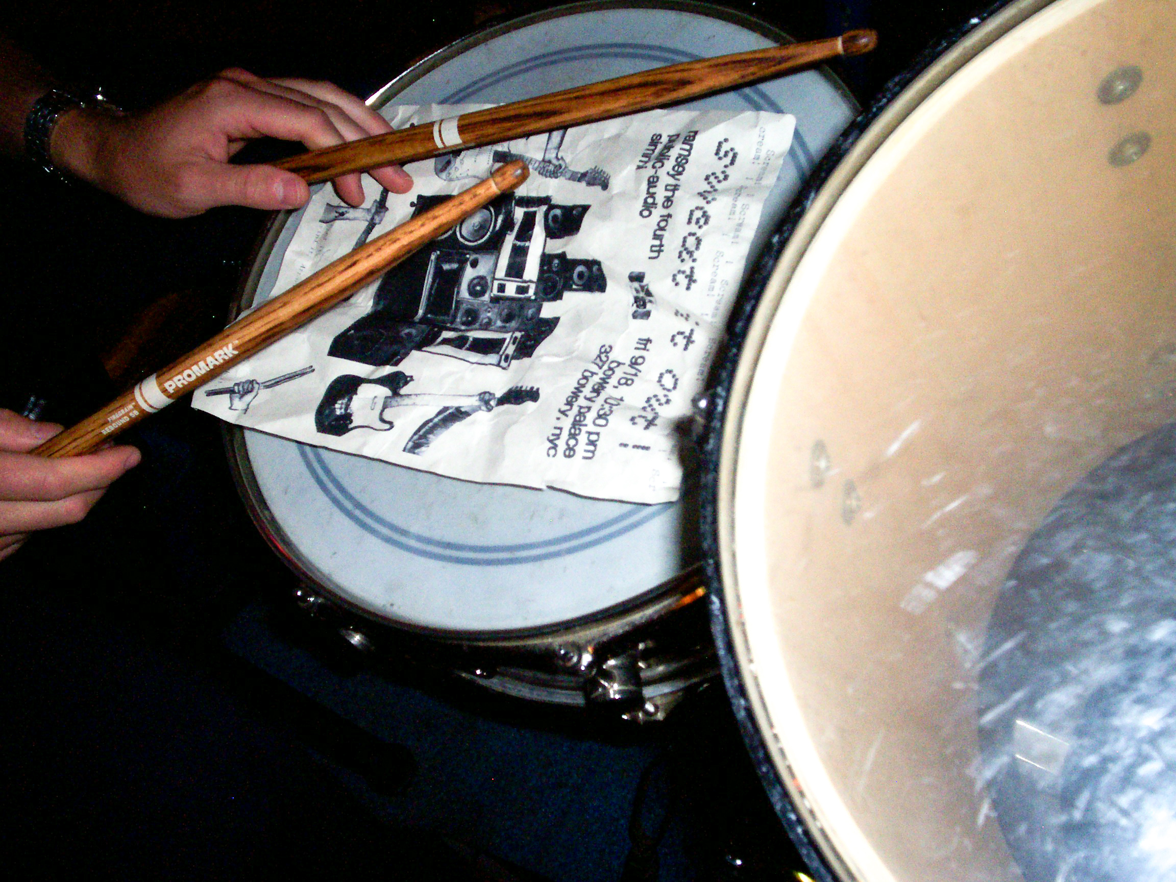 drumsticks and a drum kit