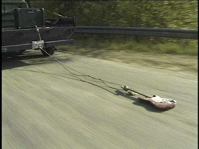 guitar being pulled behind a truck